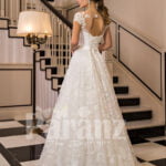 All-over lace work beautiful floor length white tulle wedding gown with royal bodice back side view