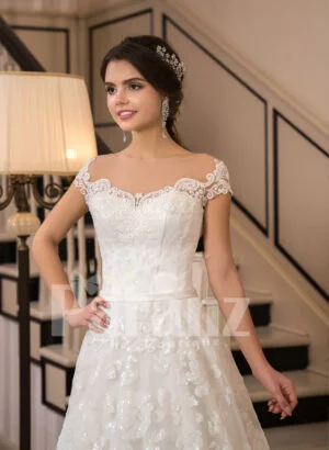 All-over lace work beautiful floor length white tulle wedding gown with royal bodice close view