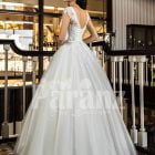 Beautiful rich white satin gown with high volume tulle underneath skirt and rich bodice back side view