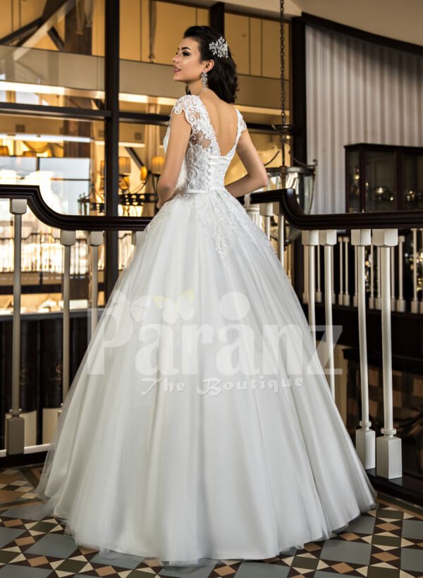 Beautiful rich white satin gown with high volume tulle underneath skirt and rich bodice back side view