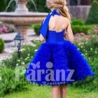 Bright royal blue close neck baby party dress with soft cloud tea length skirt back side view
