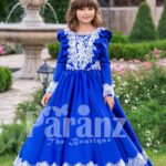 Bright royal blue full sleeve floor length rich satin dress with detail white lace work