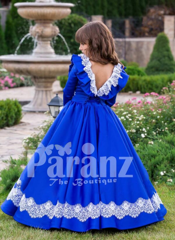 Bright royal blue full sleeve floor length rich satin dress with detail white lace work back side view