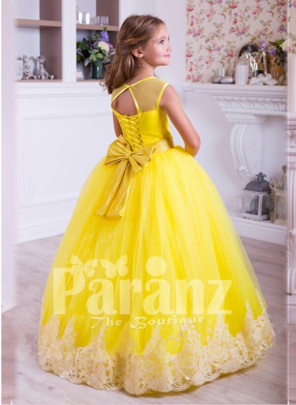 Bright yellow floor length tulle skirt dress with lace hem sleeveless satin-sheer bodice back side view