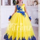 Bright yellow sleeveless floor length tulle skirt party gown with royal blue lace works