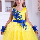 Bright yellow sleeveless floor length tulle skirt party gown with royal blue lace works for girls