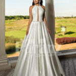 Closed neck and open back flared satin wedding gown with tulle skirt underneath