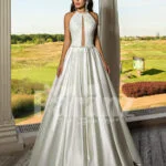 Closed neck and open back flared satin wedding gown with tulle skirt underneath