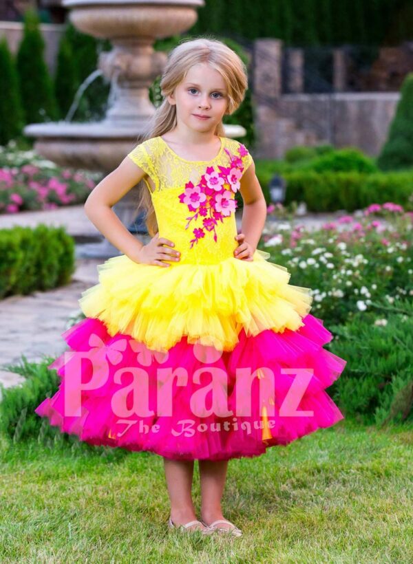 Contrast bright yellow-pink tea length baby party dress with ruffle skirt and floral bodice