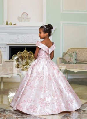 Criss-cross of shoulder style baby gown with flared and pleated high volume skirt back side view