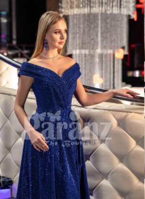 Elegant blue glitz evening gown with off-shoulder bodice and side slit skirt