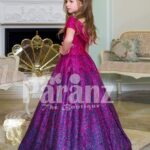 Elegant magenta pink floor length baby gown with all over blue glitz and royal bodice side view