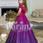 Elegant magenta pink floor length baby gown with all over blue glitz and royal bodice side view