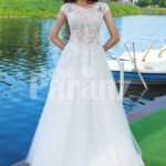 Elegant pearl white floor length flared tulle skirt wedding gown with lacy bodice