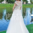 Elegant pearl white floor length flared tulle skirt wedding gown with lacy bodice back side view