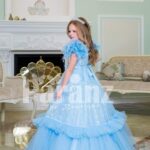 Elegant sky blue floor length baby gown with ruffle sleeve and long tulle-ruffle skirt side view