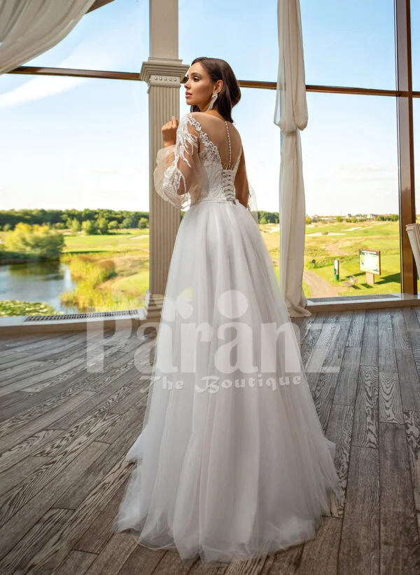 Elegant white soft tulle skirt wedding gown with full sleeve royal bodice back side view