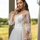 Elegant white soft tulle skirt wedding gown with full sleeve royal bodice close view