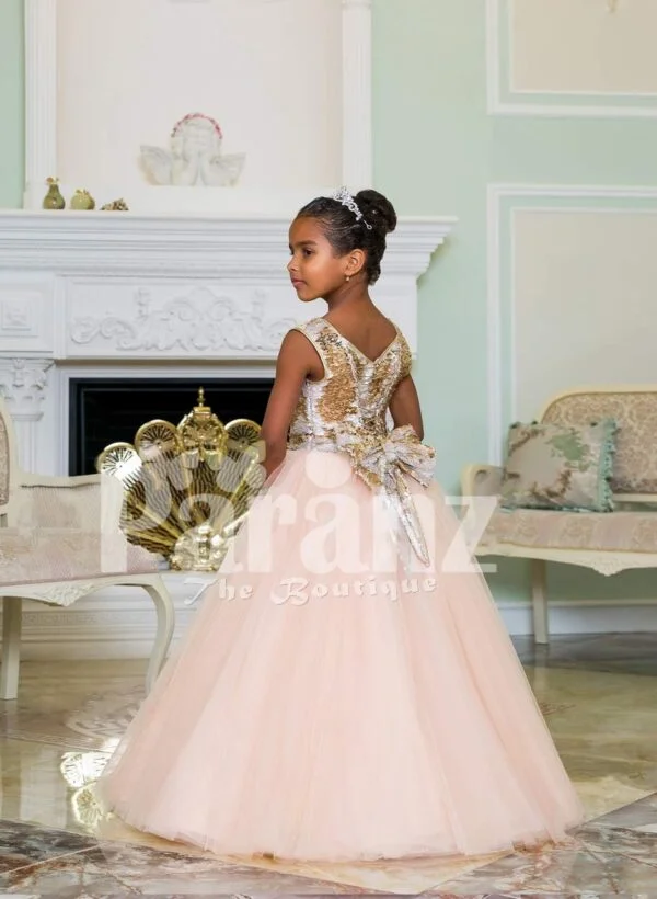 Exciting golden glitz bodice sleeveless baby gown with flared & high volume pink tulle skirt side view