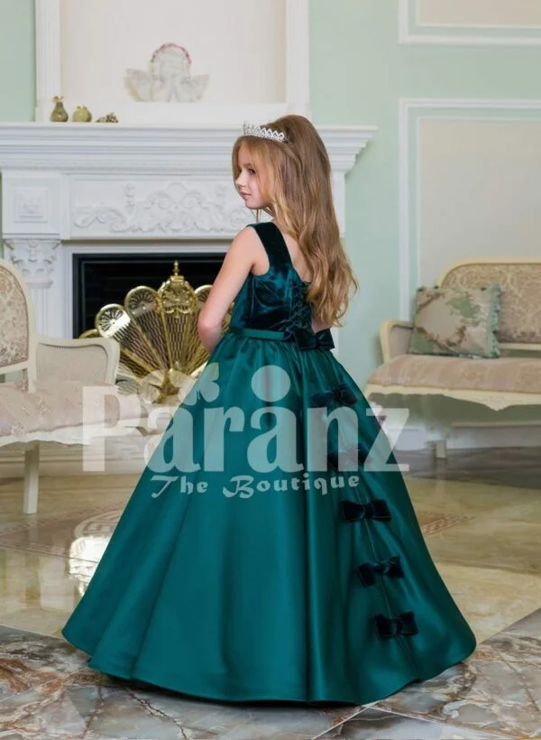 Exclusive deep green velvet bodice baby gown with rich satin bottle green floor length skirt side view