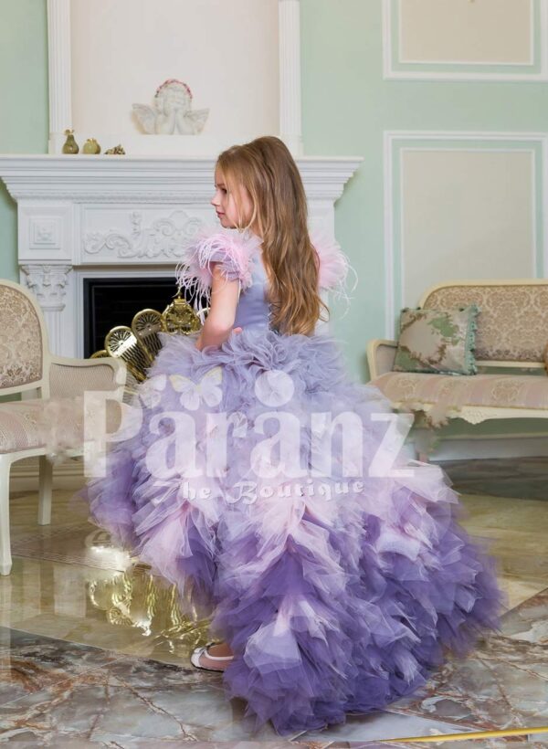 Exclusive high-low cloud tulle-ruffle skirt baby gown with beautiful bodice and feather sleeves back side view