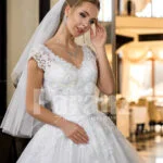 Exclusive pearl white real tulle skirt wedding gown with royal lacy bodice close view