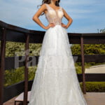 Floor length pearl white tulle wedding gown with glam sheer bodice