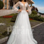 Floor length white tulle skirt gown with Arabic princess sleeves and bodice