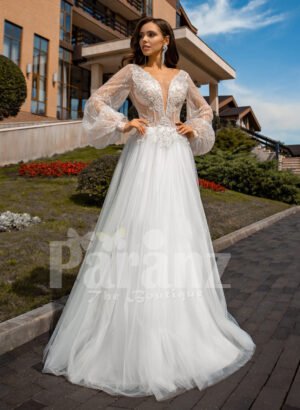 Floor length white tulle skirt gown with Arabic princess sleeves and bodice