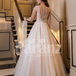 Full Arabian styled sleeve flared tulle evening gown with flower appliquéd bodice back side view