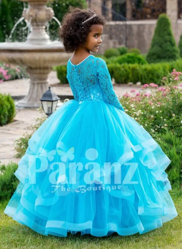 Full sleeve sky blue rich satin-sheer bodice baby party gown with multi-layer flared tulle skirt side view