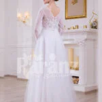 Full sleeve super stylish pearl white floor length wedding gown with tulle skirt back side view