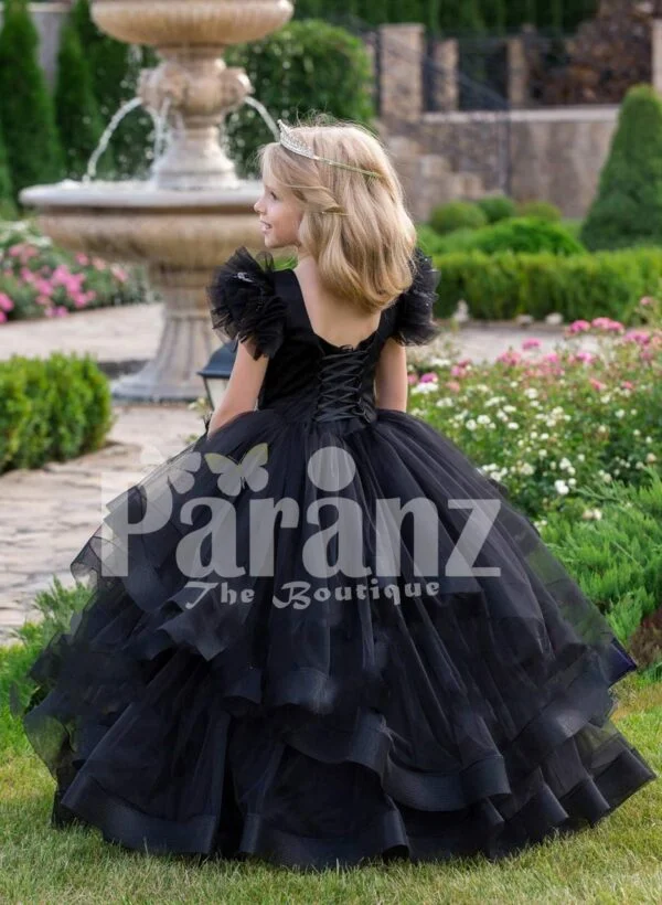 Glam black floor length multi-layer tulle skirt gown with white floral work elite bodice back side view