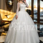 High volume tulle skirt wedding gown with full sleeve royal bodice in white