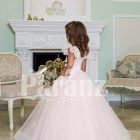 Light pink baby gown with flared and high volume tulle skirt and brown floral appliquéd bodice side view