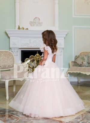 Light pink baby gown with flared and high volume tulle skirt and brown floral appliquéd bodice side view