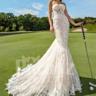 Mermaid style flared trail tulle wedding gown with rich lace work
