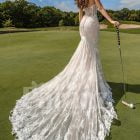 Mermaid style flared trail tulle wedding gown with rich lace work back side view