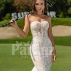 Mermaid style flared trail tulle wedding gown with rich lace work close view