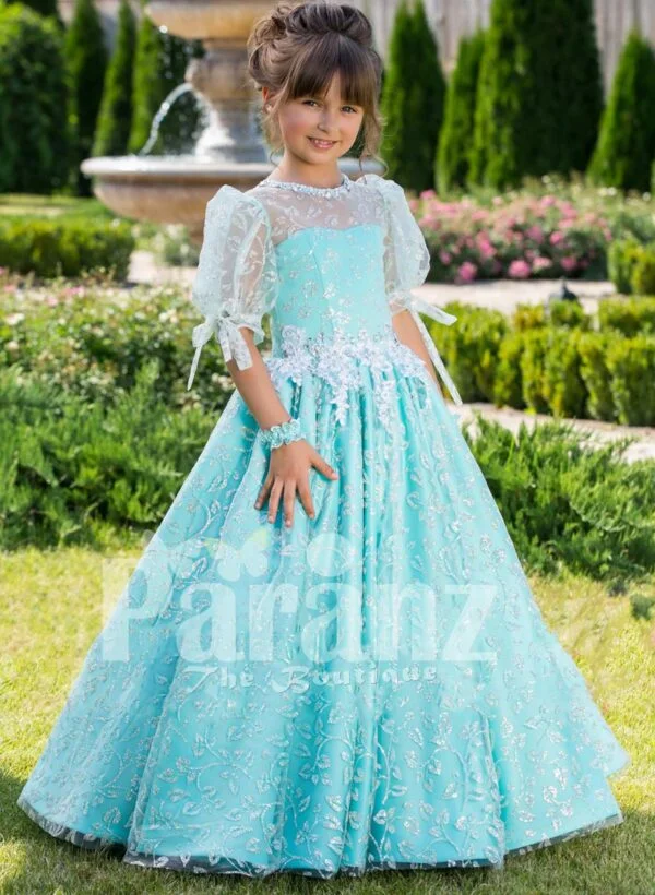 Metallic sky blue rich satin floor length baby gown with glitz floral works all over