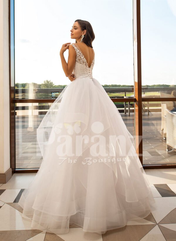 Multi-layer flared tulle skirt pearl white wedding gown with glam bodice back side view