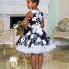 Navy blue tea length tulle skirt sleeveless party dress with white ball print all over back side view