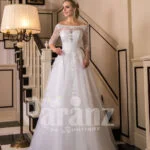 Off-shoulder pearl white floor length flared wedding tulle gown