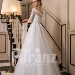 Off-shoulder pearl white floor length flared wedding tulle gown side view