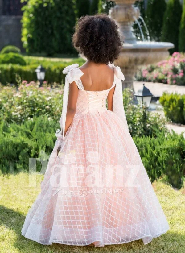 Peach pink unique sleeveless baby gown with flared tulle skirt and sheer overskirt back side view