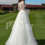 Pearl white elegant long and soft full sleeve wedding tulle gown back side view