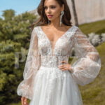 Pearl white glam tulle wedding gown with royal bodice and sleeves close view