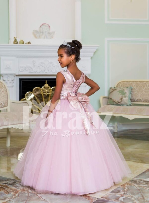 Pink glitz sleeveless bodice baby gown with flared and high volume tulle skirt side view