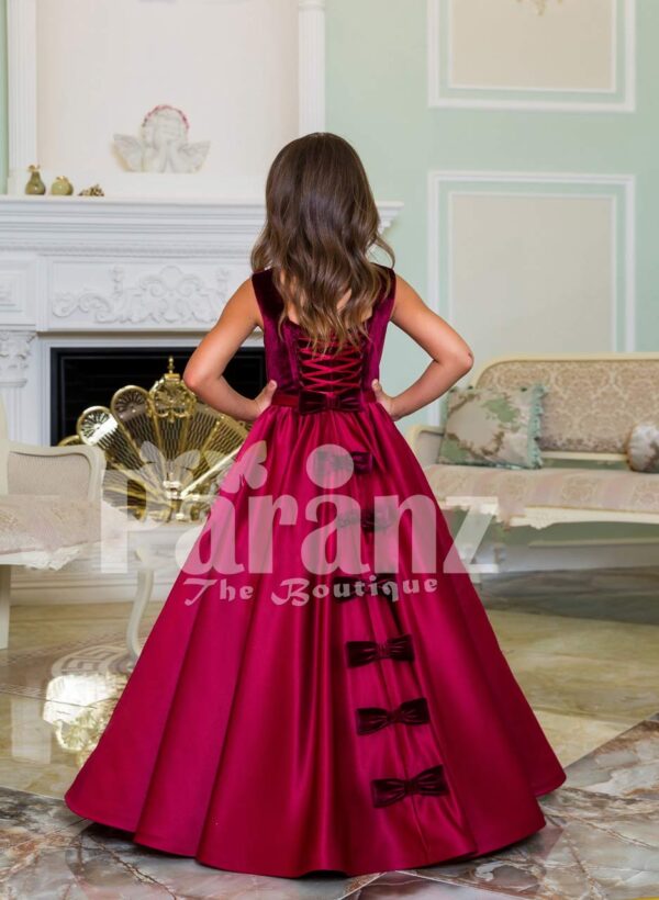 Purple velvet bodice exclusive baby gown with flared rich satin floor length gown in magenta back side view
