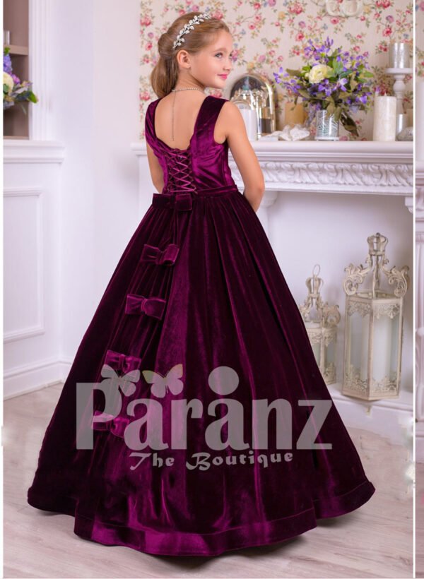 Rich satin floor length baby party gown with tulle skirt underneath and rhinestone waist belt side view